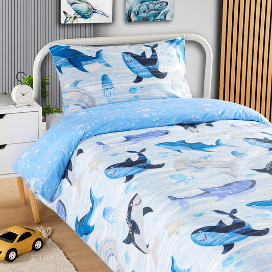 Luxurious reversible duvet cover featuring vibrant marine life design with sharks and whales, perfect for a child's bedroom decor.