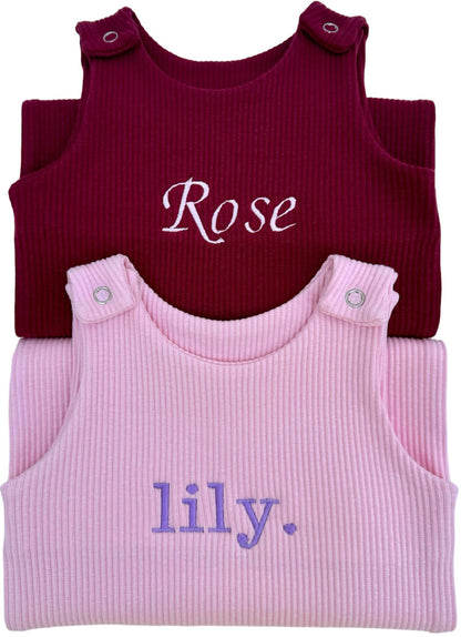 Luxurious personalised pink dungarees romper for babies by DreamBuy, crafted from soft cotton for ultimate comfort, ideal as a unique gift for newborns and toddlers.