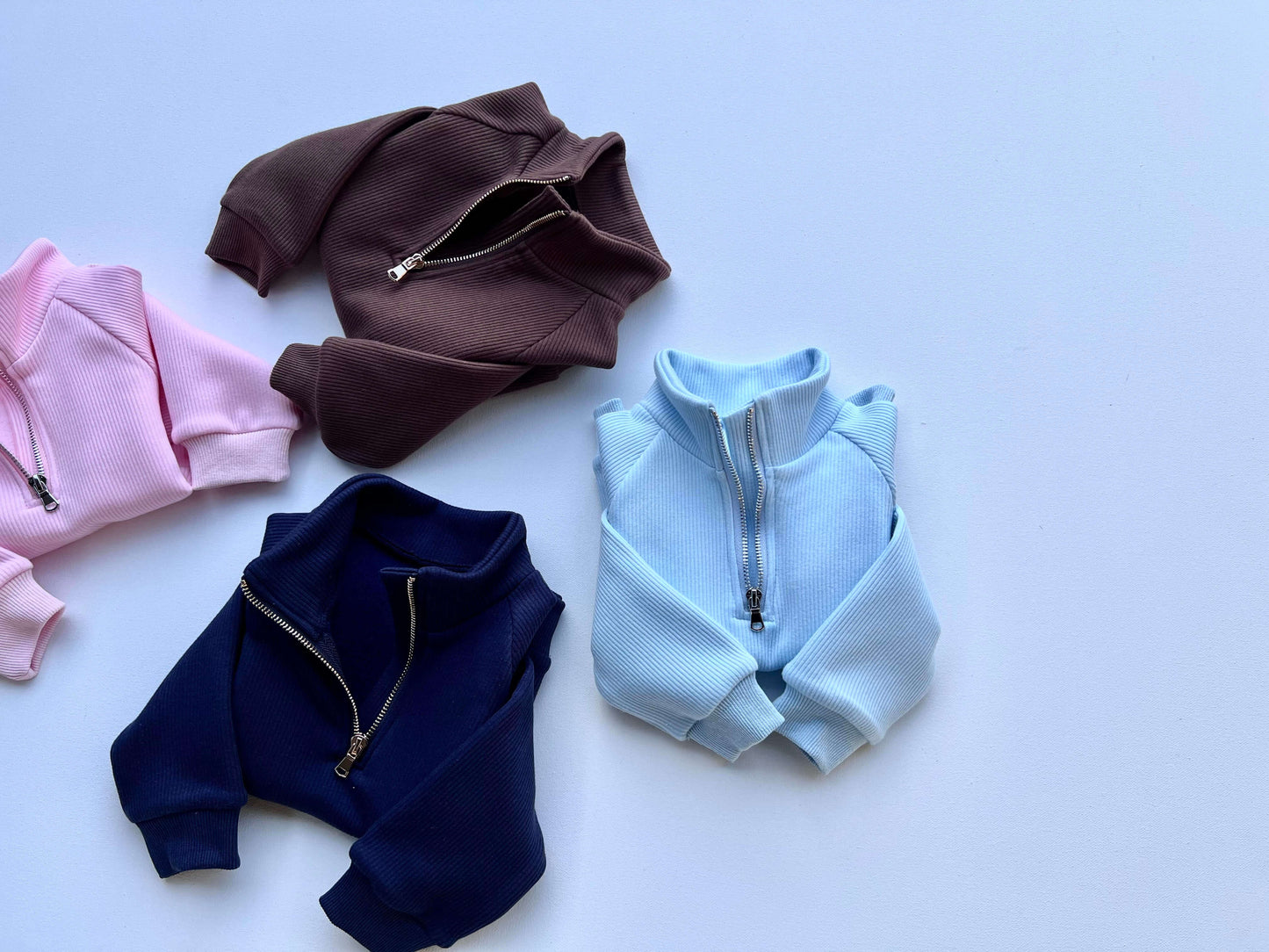 DreamBuy's premium Frost Blue Ribbed Cotton Fleece Tracksuit for children, featuring snug double-layered collar and convenient pockets.