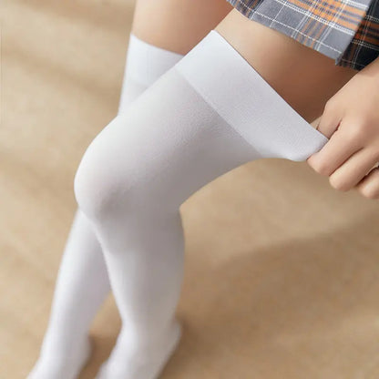 Elegant pose highlighting Women's Black White Solid Color Long Socks Stockings, emphasizing the snug fit and soft fabric against a stylish backdrop.