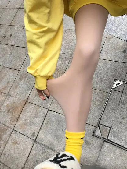 Women's Secret Sheer Plush Lined Tights showcased in a stylish outfit, offering elegant warmth and comfort for chilly days.