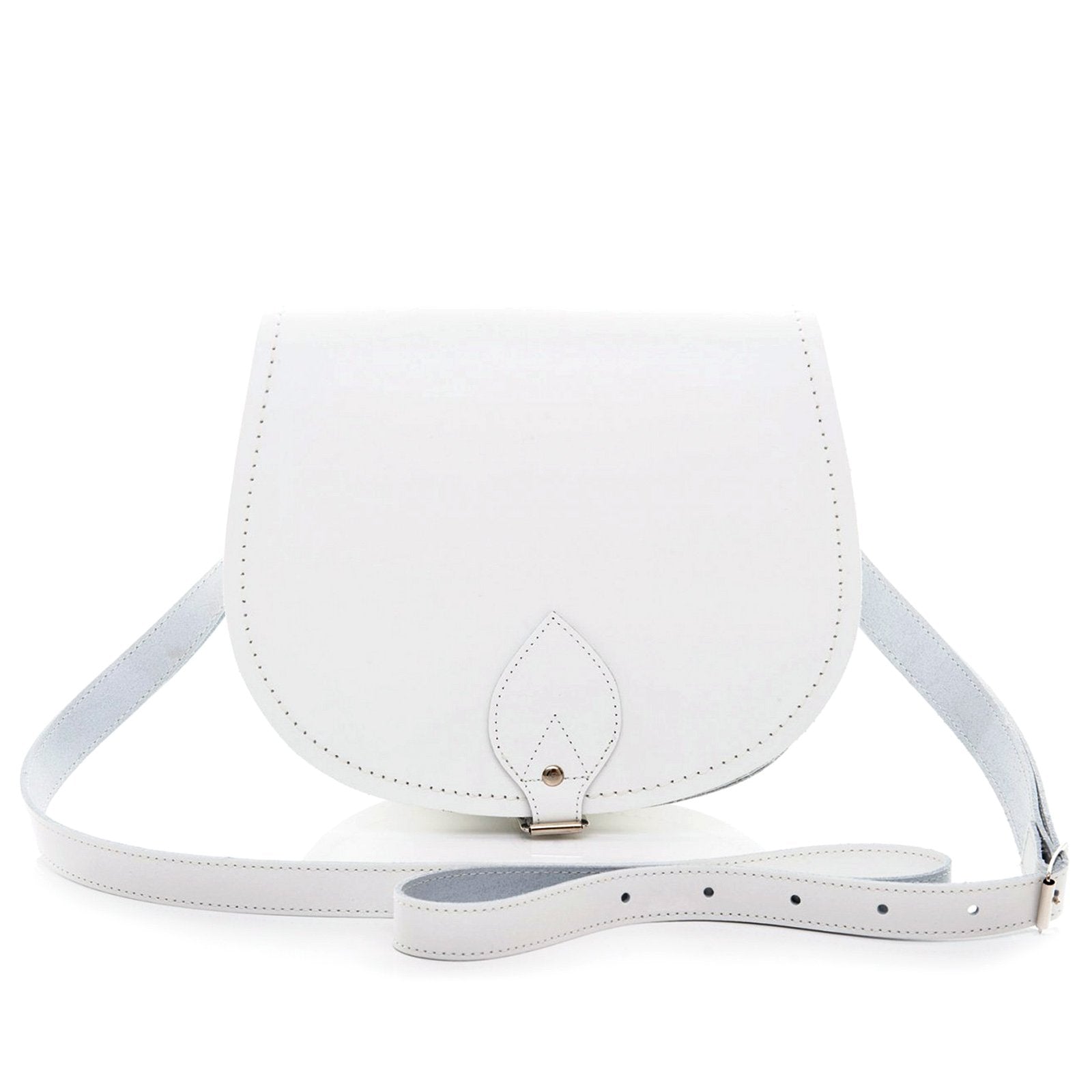 Exquisite Handmade White Leather Saddle Bag featuring adjustable crossbody design, crafted in premium leather with contrasting stitching, perfect for stylish everyday use. Available in two sizes and customizable with inner engraving.