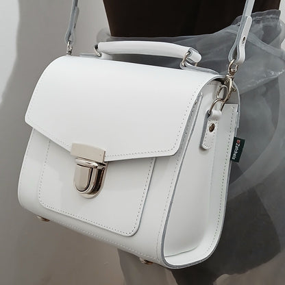 Impeccably crafted Handmade White Leather Sugarcube Handbag in a pristine white finish, exemplifying fine craftsmanship and an essential accessory for fashion-forward individuals.