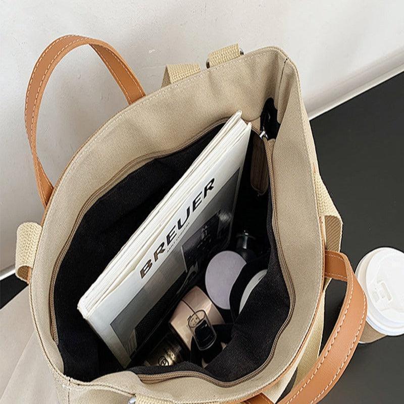 Trendy women's handbag featuring chic design elements, a must-have accessory for every wardrobe.