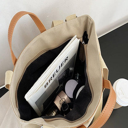 Trendy women's handbag featuring chic design elements, a must-have accessory for every wardrobe.