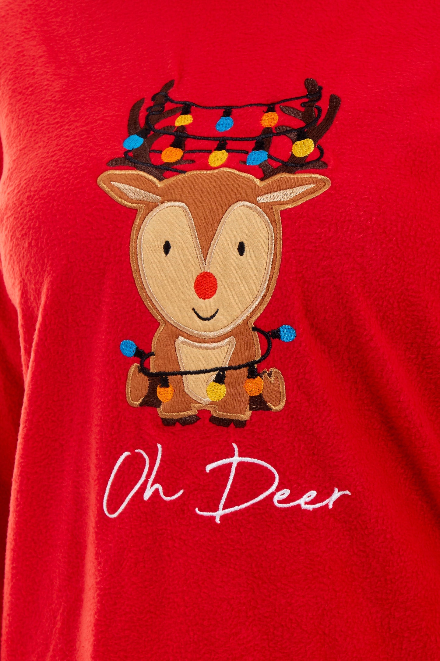 Stylish contrasting patterned bottoms of Women's Ultra-Soft Polar Fleece Pyjama Set featuring elegant festive reindeer motif, ideal for sophisticated winter lounging.