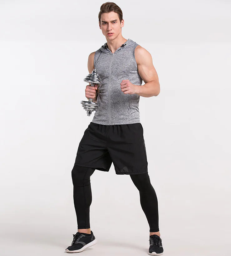 Athletic man showcasing the versatility of a sleeveless workout shirt while lifting dumbbells.