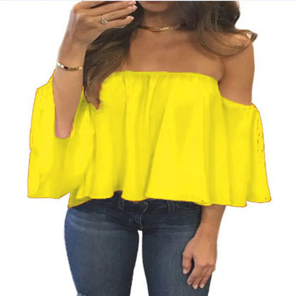 Vibrant yellow chiffon blouse featuring a flowing off-shoulder design, paired stylishly with casual jeans.