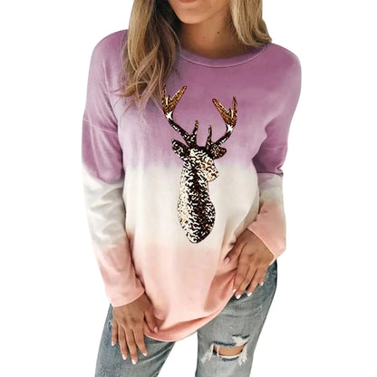 Trendy women's reindeer sweater showcasing a captivating purple gradient with sequined deer, ideal for an elegant holiday look.