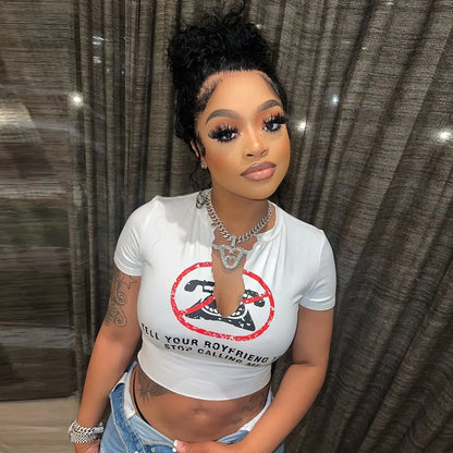 Stylish white graphic crop top featuring 'Tell Your Boyfriend to Stop Calling Me' slogan, designed by Dazzling Dreams Studio for a chic and playful look.