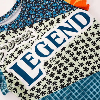 Sweet Legend Women's Vibrant Print Cropped Tee by Dazzling Dreams Studio showcasing whimsical design with intricate patterns in vivid hues, ideal for a chic casual look.