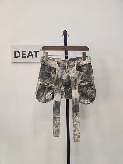 Close-up of the DEAT Women's Distressed Denim Skirt's camouflage design and intricate detailing, showcasing the craftsmanship by Dazzling Dreams Studio.