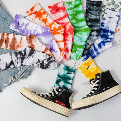 Luxurious Women's Tie-Dye Middle Tube Socks displayed in various vibrant colours, paired with stylish sneakers, showcasing comfortable fashion for all-day style.