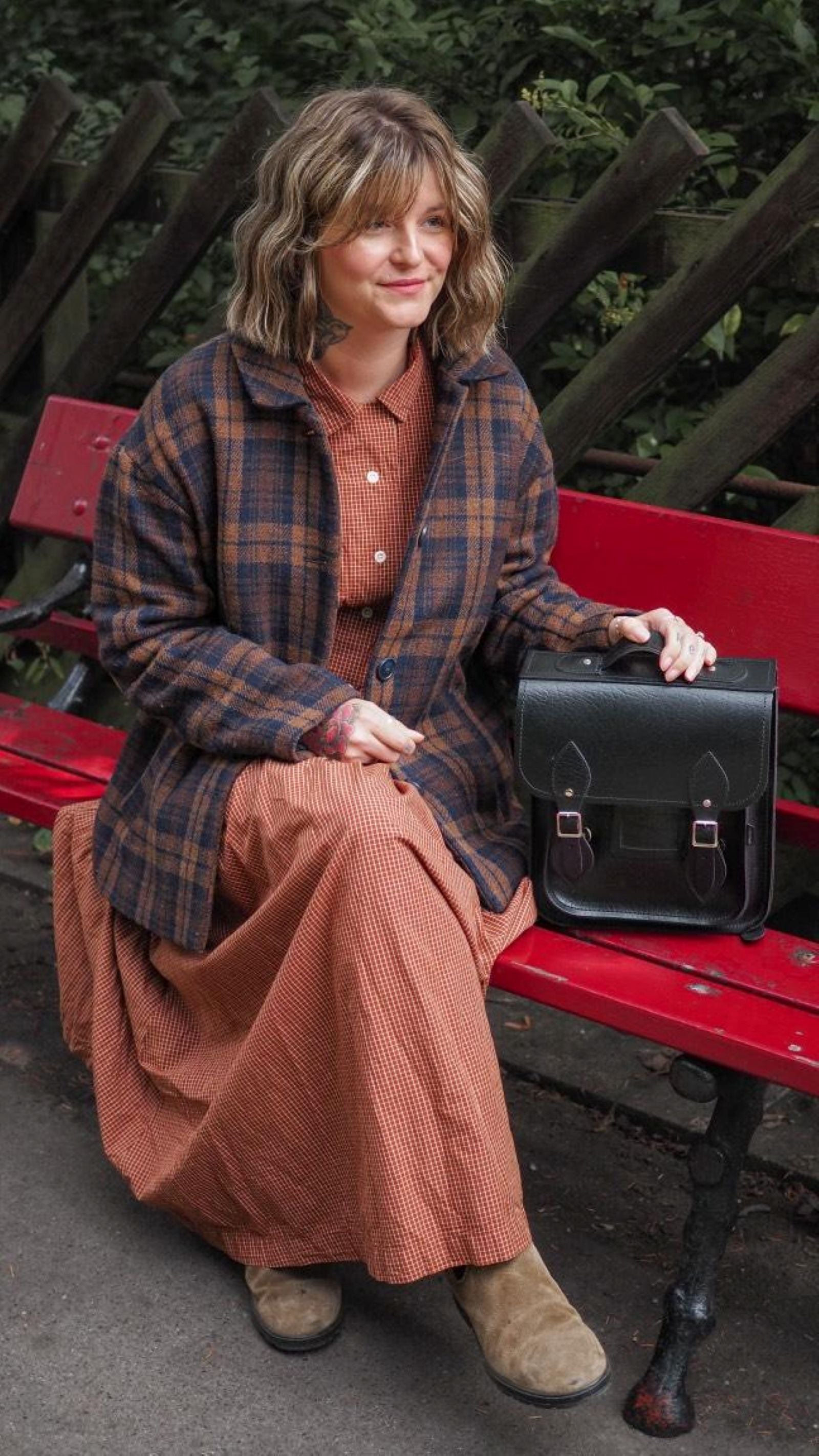 Elegant Black Leather City Backpack in Small and Plus sizes, perfect for urban adventures and stylishly accommodating tech essentials.