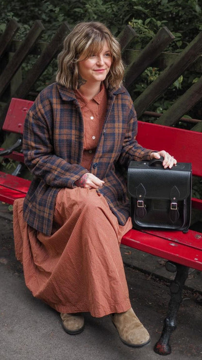 Elegant Black Leather City Backpack in Small and Plus sizes, perfect for urban adventures and stylishly accommodating tech essentials.